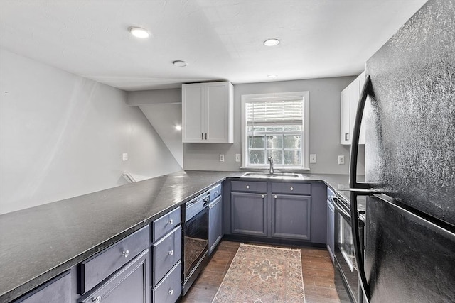 13 Berrington Rd Unit 13, Leominster, MA 01453 - kitchen featuring black appliances, dark wood-type flooring, white cabinets, dark countertops, and recessed lighting