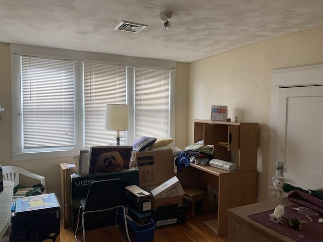 office space with hardwood / wood-style floors