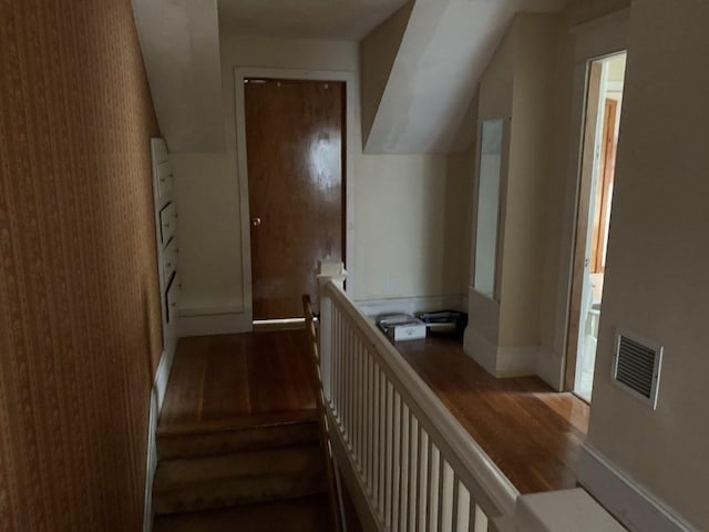 stairway featuring hardwood / wood-style flooring