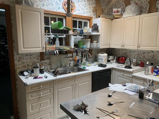 kitchen featuring sink, white cabinets, and black dishwasher