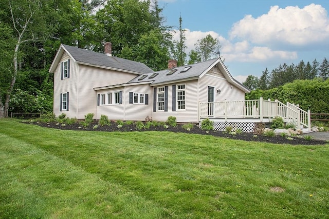 383 Westhampton Rd, Northampton, MA 01062 - view of front of home featuring a chimney, a wooden deck, and a front lawn