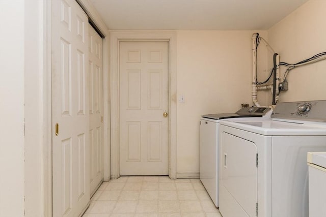 laundry room with separate washer and dryer