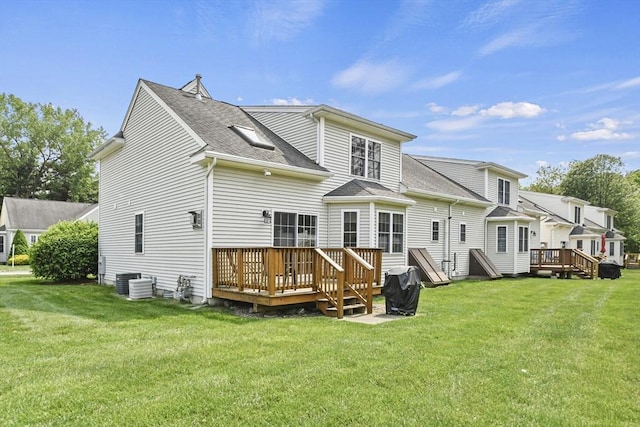 7 Myra Ln Unit 11, Worcester, MA 01606 - back of property with a wooden deck, a yard, and roof with shingles