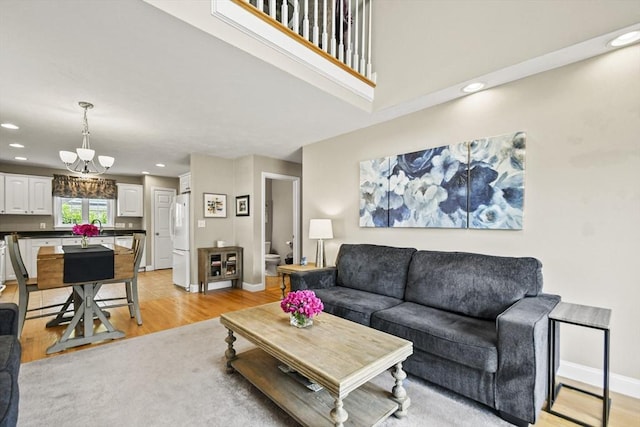 7 Myra Ln Unit 11, Worcester, MA 01606 - living area with light wood-style floors, recessed lighting, a chandelier, and baseboards