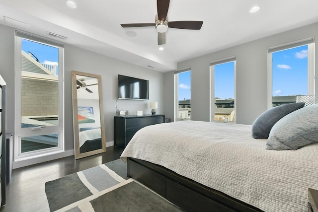 bedroom with ceiling fan, wood finished floors, visible vents, and recessed lighting