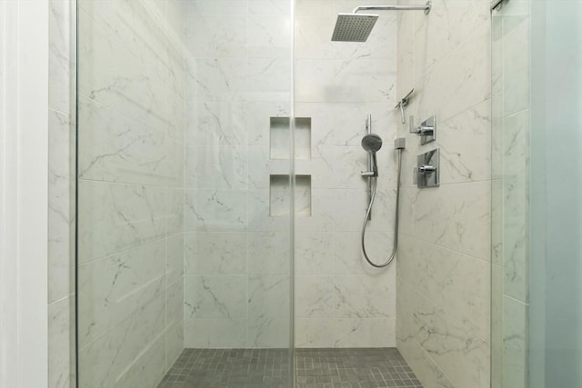 bathroom featuring a shower stall