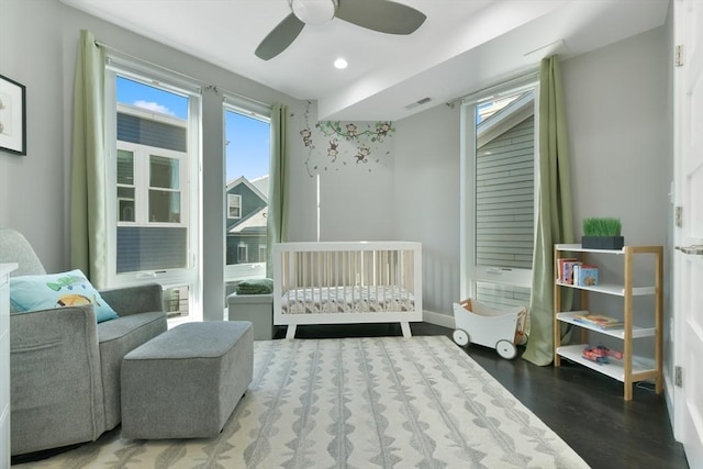 bedroom featuring ceiling fan, recessed lighting, wood finished floors, visible vents, and baseboards