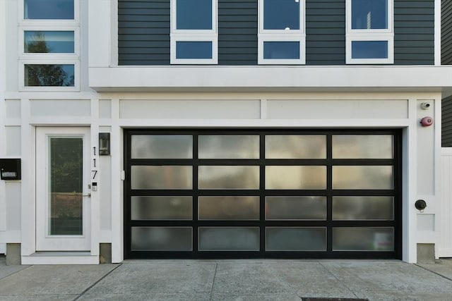 exterior space featuring concrete driveway