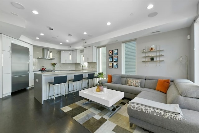 living area with visible vents and recessed lighting