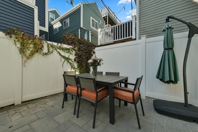 view of patio / terrace featuring outdoor dining space and fence