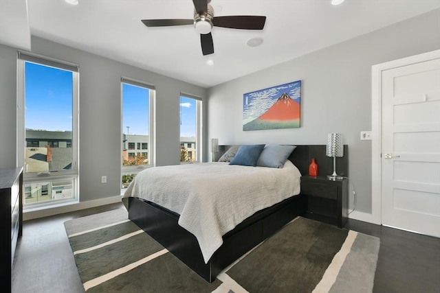 bedroom with dark wood-style floors, ceiling fan, recessed lighting, and baseboards