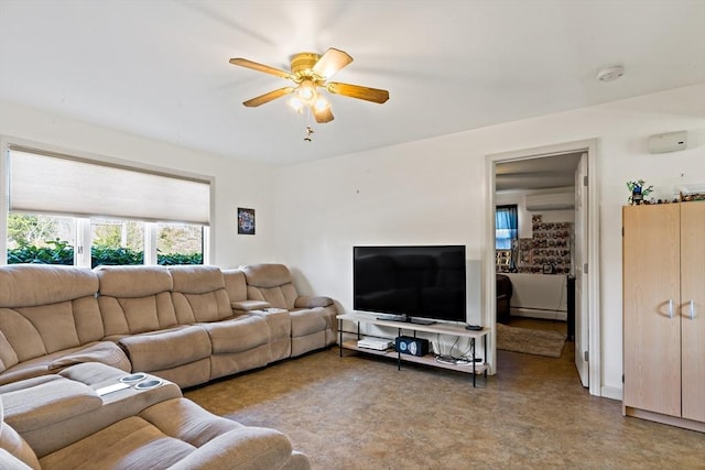 living room featuring ceiling fan and a wall mounted AC