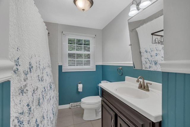 full bathroom with toilet, tile patterned floors, vanity, and curtained shower