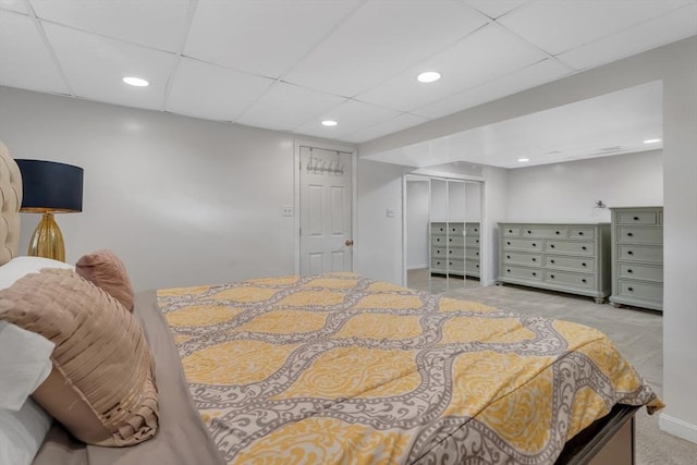 bedroom with a paneled ceiling, recessed lighting, and carpet flooring