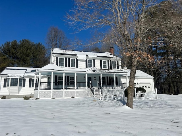 view of front of property featuring covered porch and a chimney