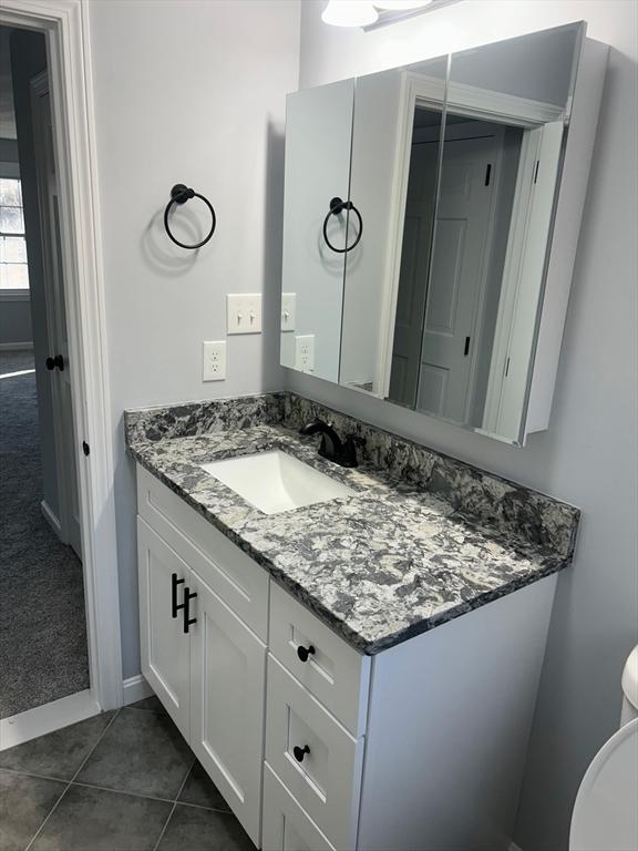 bathroom featuring vanity and tile patterned floors