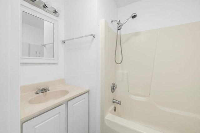 bathroom featuring shower / bath combination and vanity