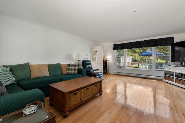 living room featuring light wood-type flooring, a baseboard heating unit, and ornamental molding