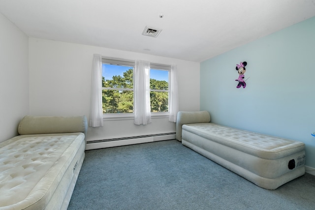 bedroom with carpet floors and baseboard heating