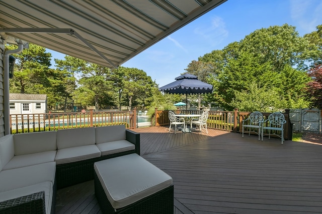 wooden deck with an outdoor living space