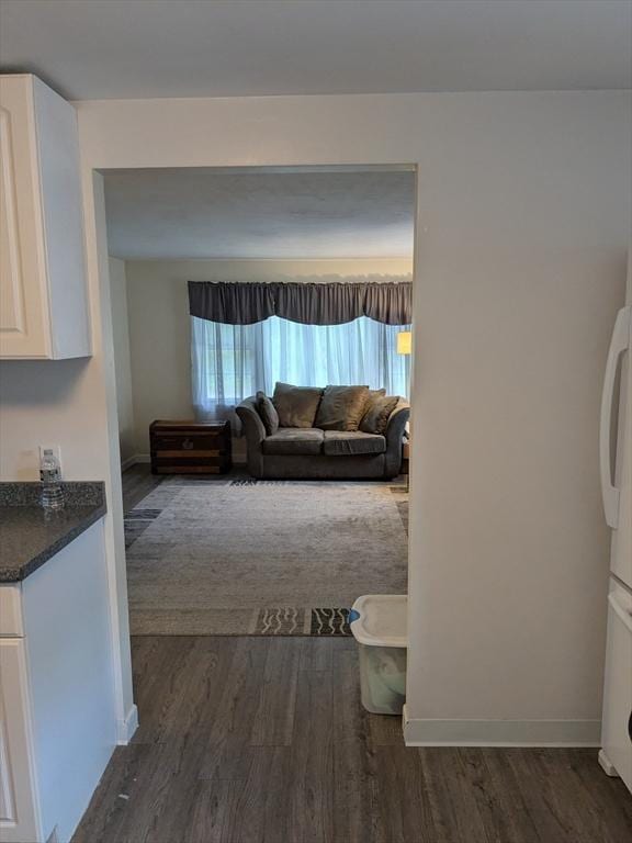 9 New Boston Rd, Dudley, MA 01571 - living area featuring dark wood-type flooring and baseboards