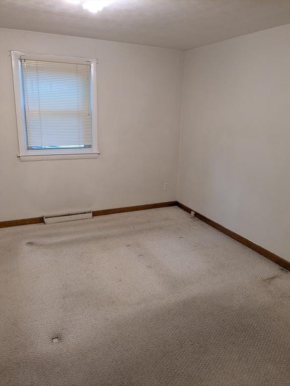 9 New Boston Rd, Dudley, MA 01571 - spare room with light colored carpet, a baseboard radiator, and baseboards