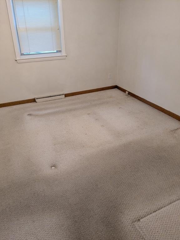 9 New Boston Rd, Dudley, MA 01571 - empty room with a baseboard radiator, carpet flooring, and baseboards