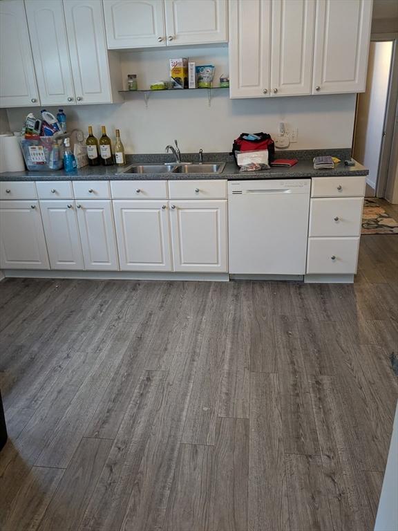 9 New Boston Rd, Dudley, MA 01571 - kitchen featuring dishwasher, a sink, dark wood-style floors, open shelves, and dark countertops