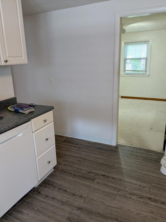 9 New Boston Rd, Dudley, MA 01571 - kitchen with white dishwasher, white cabinetry, dark countertops, and dark wood-style floors