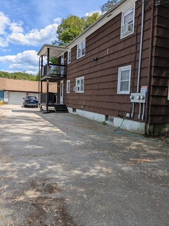 9 New Boston Rd, Dudley, MA 01571 - view of side of property with a balcony and cooling unit