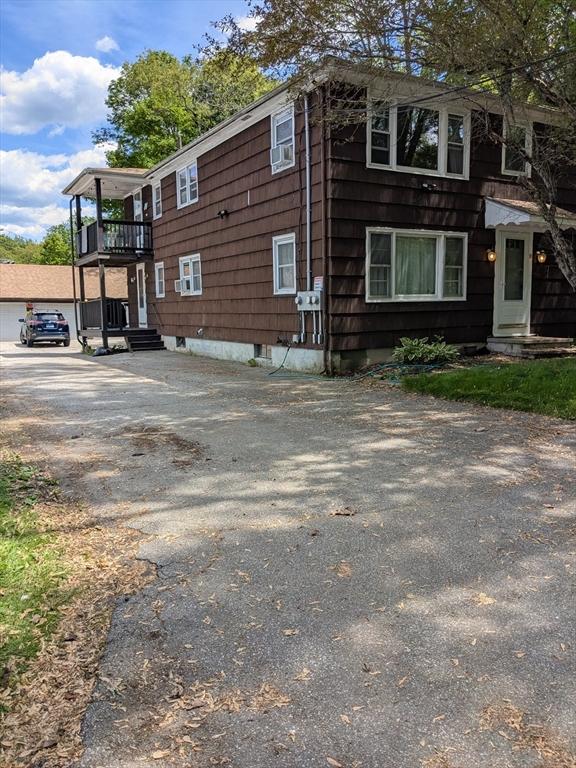 9 New Boston Rd, Dudley, MA 01571 - view of property exterior with a balcony and driveway