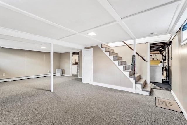 basement with a baseboard radiator and carpet floors