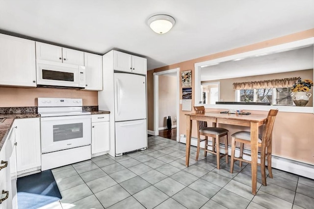 kitchen featuring white appliances, a baseboard heating unit, and white cabinetry