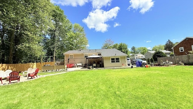 9 Willow Rd, Holbrook, MA 02343 - rear view of property featuring a gazebo, an outdoor fire pit, and a patio