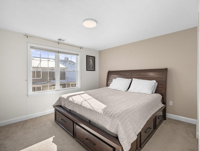 bedroom featuring light colored carpet