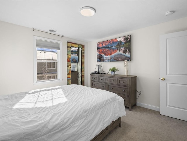 bedroom with light carpet