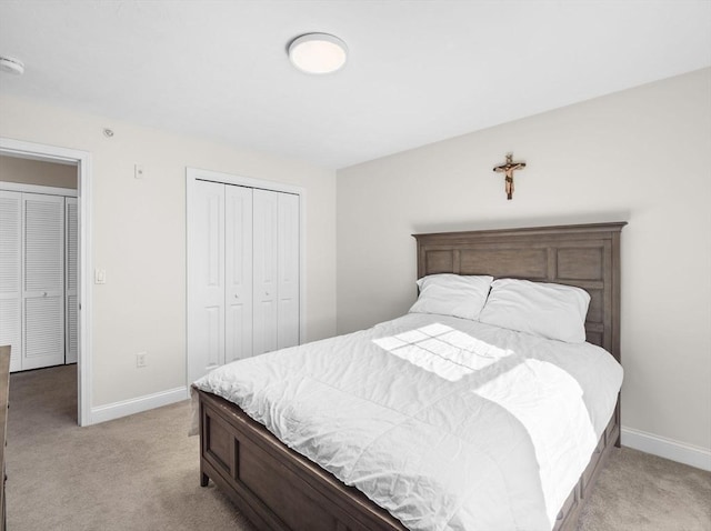 carpeted bedroom with a closet