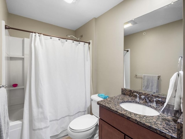 full bathroom with vanity, shower / bath combo, and toilet