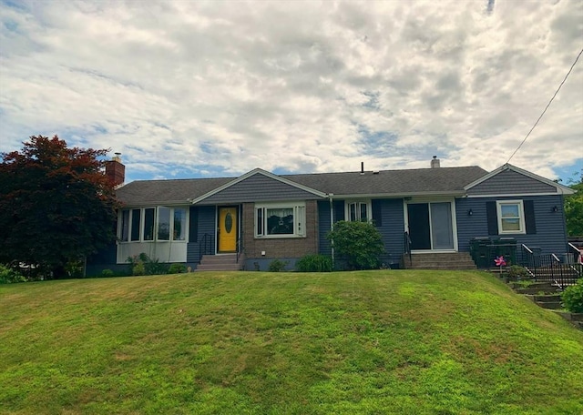 77 Westwood Pkwy, Southbridge, MA 01550 - single story home with entry steps, a chimney, and a front lawn