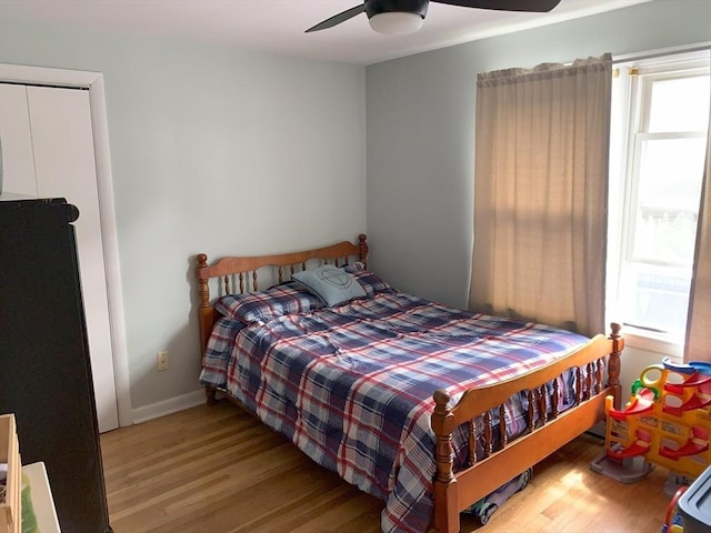 77 Westwood Pkwy, Southbridge, MA 01550 - bedroom with multiple windows, wood finished floors, and a ceiling fan
