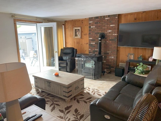 77 Westwood Pkwy, Southbridge, MA 01550 - living area with wooden walls and a wood stove