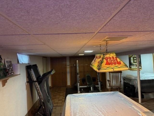 77 Westwood Pkwy, Southbridge, MA 01550 - game room featuring tile patterned floors and a drop ceiling
