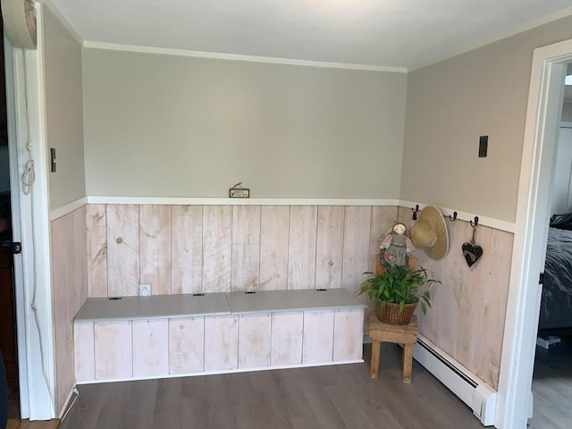 77 Westwood Pkwy, Southbridge, MA 01550 - mudroom featuring a baseboard heating unit, wood finished floors, a wainscoted wall, ornamental molding, and wooden walls