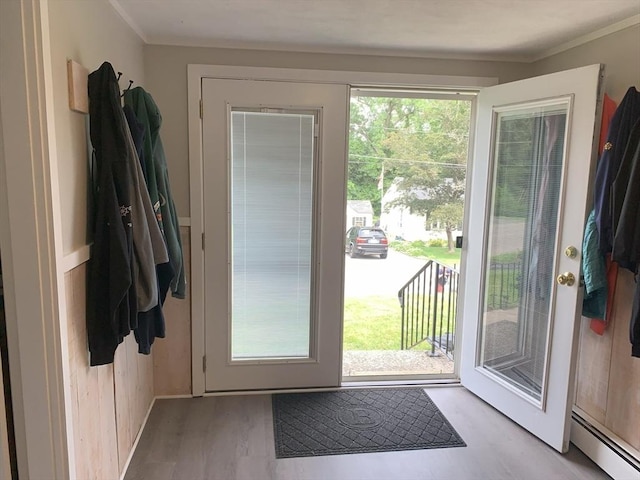 77 Westwood Pkwy, Southbridge, MA 01550 - entryway featuring a baseboard radiator, light wood-style flooring, and ornamental molding