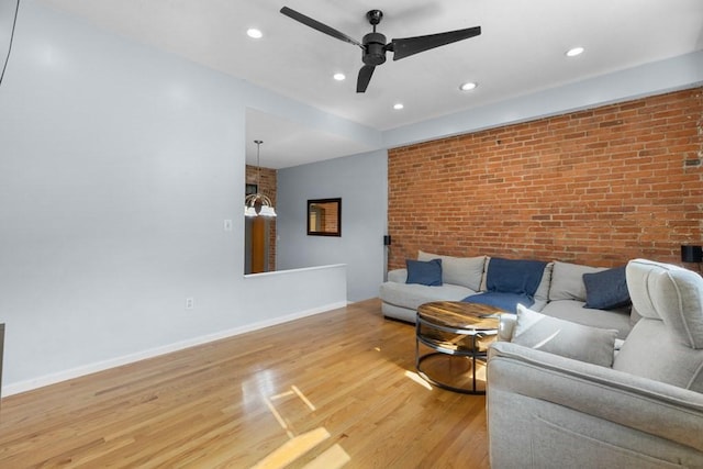 80 Beaumont St Unit 101, Boston, MA 02124 - living area featuring brick wall, light wood-type flooring, recessed lighting, and a ceiling fan