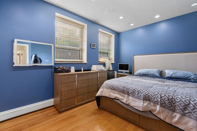 80 Beaumont St Unit 101, Boston, MA 02124 - bedroom featuring baseboard heating, light wood-style floors, and recessed lighting