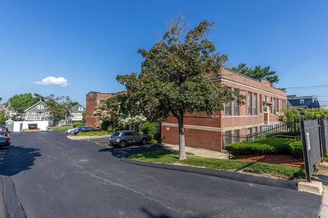 80 Beaumont St Unit 101, Boston, MA 02124 - view of property with uncovered parking and a residential view