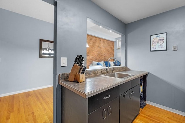 80 Beaumont St Unit 101, Boston, MA 02124 - kitchen with light wood-style flooring and tile counters