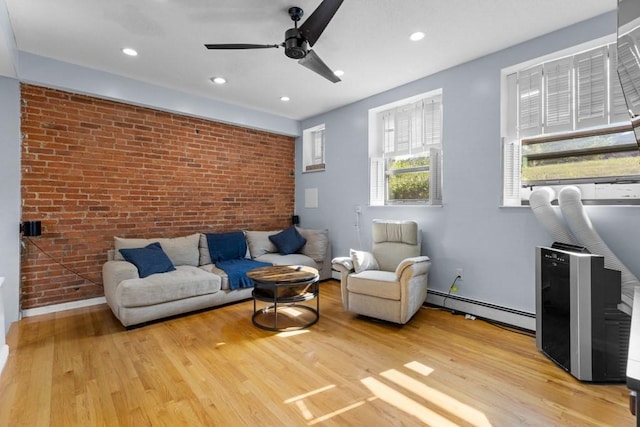 80 Beaumont St Unit 101, Boston, MA 02124 - living area featuring baseboard heating, brick wall, wood finished floors, a ceiling fan, and recessed lighting