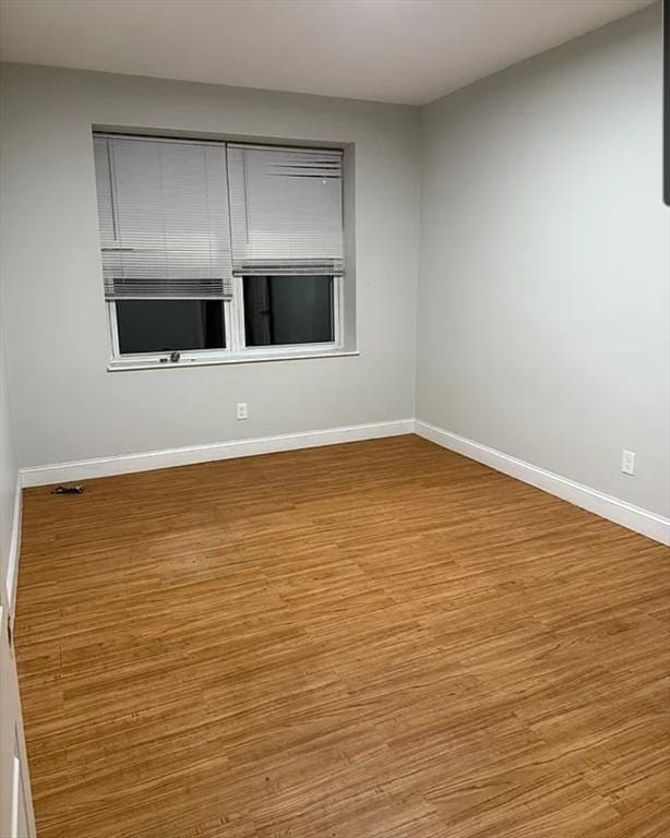 7 Esmond St, Boston, MA 02121 - spare room with baseboards and wood finished floors